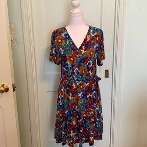 NWOT faux wrap with ruffle hem floral dress made by West K. Size M. Machine wash